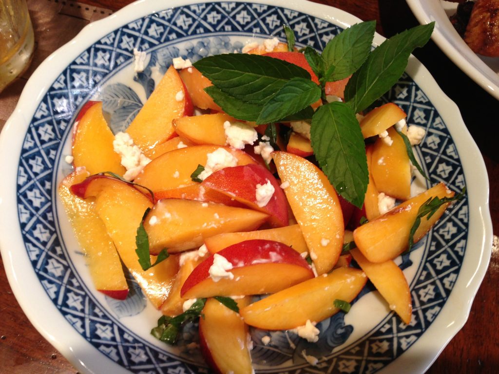 Sliced peaches tossed with a hint of chipotle powder, drizzled with local honey and sprinkled with goat cheese (and sometime pecans). A chiffonade of fresh mint adds the finishing touch!